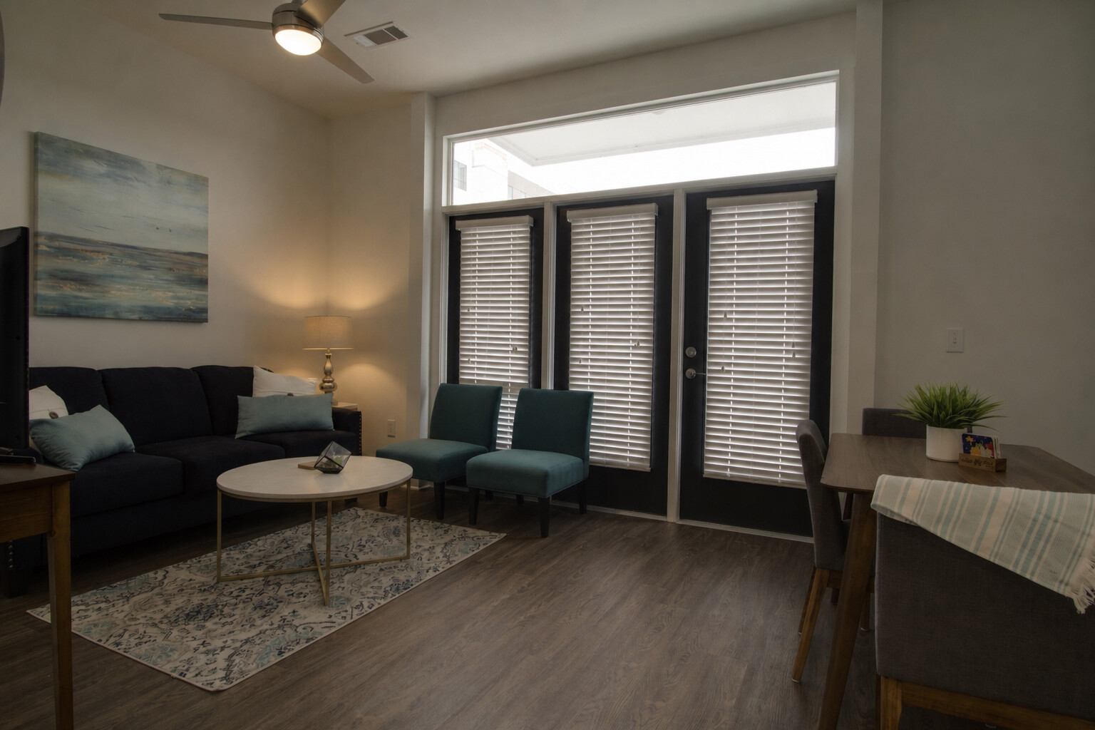 A living room before enhancement — flat light, muted colour