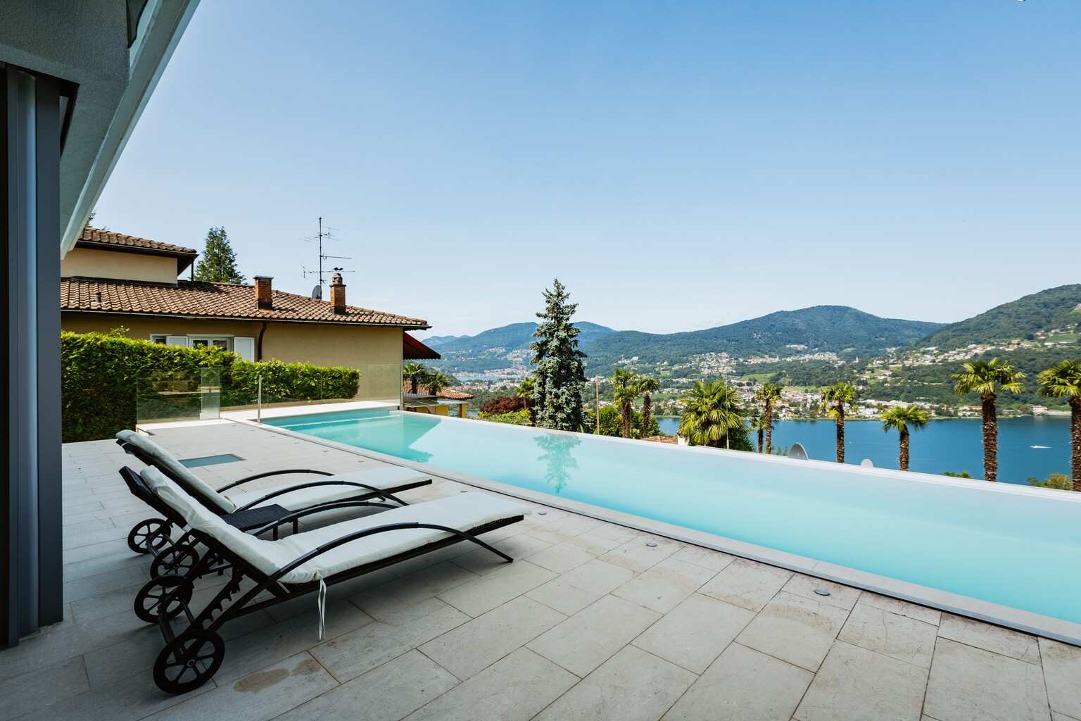 An infinity pool terrace photographed in daylight
