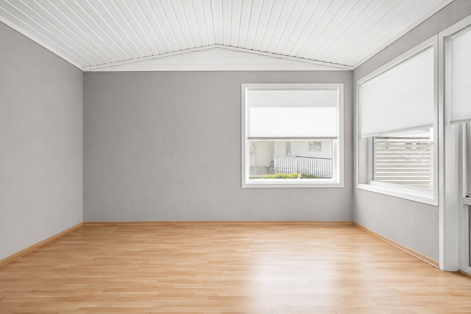 An empty living room with bare floorboards